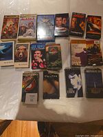 Full layout of 16 VHS tapes on table