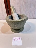 Mortar with pestle inserted, full view