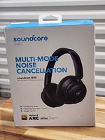 Front of retail box showing Soundcore Q30 features