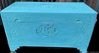 Front and lid of turquoise carved camphor wood trunk