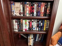 Front view of two shelves filled with VHS tapes