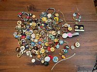 Overhead view of entire unsorted jewellery lot spread on table