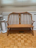 Full front view of Windsor-style wooden bench