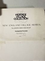 Heritage Village Collection label showing series and model name