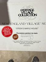Box top showing Heritage Village Collection branding and model name Steen's Maple House