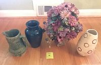 Group shot of all four items: green pitcher, blue vase, faux floral arrangement, off-white hexagon vase