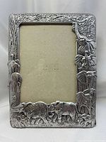 Front view of pewter frame with elephant motif