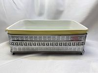 Casserole insert seated in metal stand, front view
