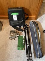 Group shot of camera, tripod, both bags and Cullmann leaflet