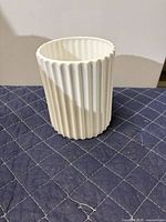 Full view of white ribbed vase
