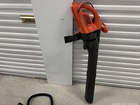 Full view of main handheld blower/vacuum body with attached tube