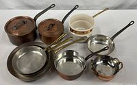 Entire lot arranged showing all copper pieces and ceramic insert