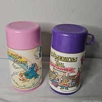 Front view of both thermoses side by side