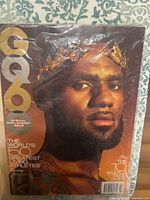 Front cover in protective plastic featuring LeBron James portrait and GQ logo