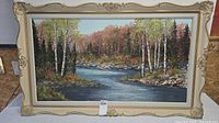 Full view of framed landscape painting