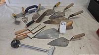 Group shot of all masonry tools, rasps, hacksaws, scraper and pipe cutter