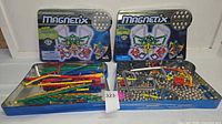 Overall lot showing two Magnetix boxes and trays of rods and spheres