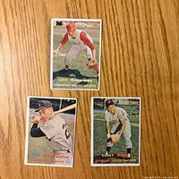 Fronts of three 1957 Topps baseball cards showing Alex Grammas, José Valdivielso, Bobby Avila