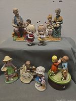 Full lot view showing eight Lina porcelain figurines