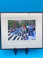 Full view of framed print showing artwork, mat, and frame