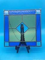 Front view of full stained glass panel on stand