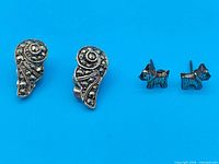 Front view of both earring pairs showing designs and marcasite