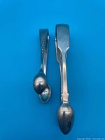 Both sugar tongs full view