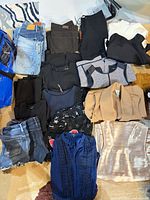 Lot overview showing all ten clothing pieces laid out