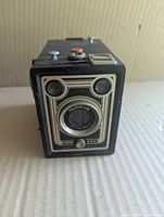 Front view showing art-deco faceplate and lens