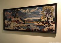 Full view framed needlepoint on wall
