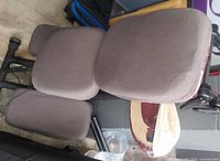 Top view showing seat, chest pad and knee pads with grey covers