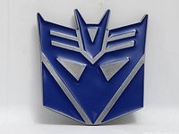 Front view blue Decepticon belt buckle