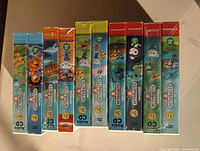 Top view of nine sealed Octonauts audio CD boxes showing spines and volume numbers
