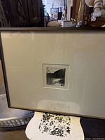 Full view of framed artwork showing mat, image and frame
