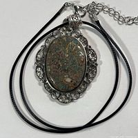 Front view of pendant on cord