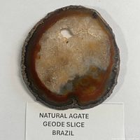 Front view of agate slice showing coloration and cavity