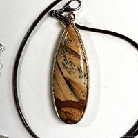Front view of pendant on cord