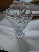 Front view of clear cut crystal vase showing starburst pattern and overall form