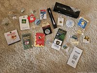 Full lot layout showing all enamel pins, buttons and boxed item