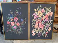 Both framed floral prints side by side
