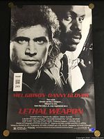 Full view of signed Lethal Weapon poster with WWOC QR sticker