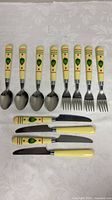 All 13 pieces laid out showing handles and utensil ends