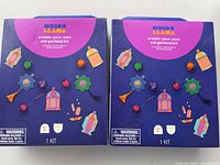 Two sealed purple boxes of Mondo Llama create-your-own Eid garland kits
