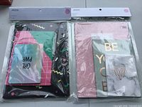 Both sealed Ardene notebook packs side by side