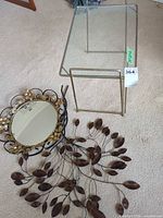 Group shot showing side table, mirror and wall art together