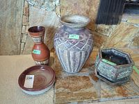 Group shot showing all four ceramic pieces with size tags