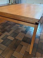 Table top and legs showing veneer and joinery