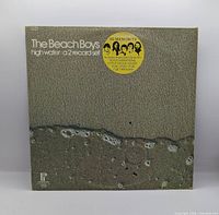 Front cover showing title, artist, hype sticker, artwork