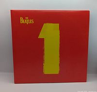 Front gatefold cover showing yellow 1 on red background