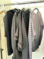 Six tops on hangers showing overall lot